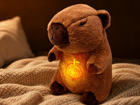 Sanki breathing capybara plush glowing softly on a knit blanket
