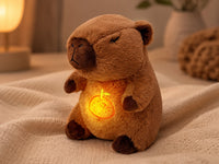 Sanki breathing capybara plush glowing on a cozy bed with a warm lamp